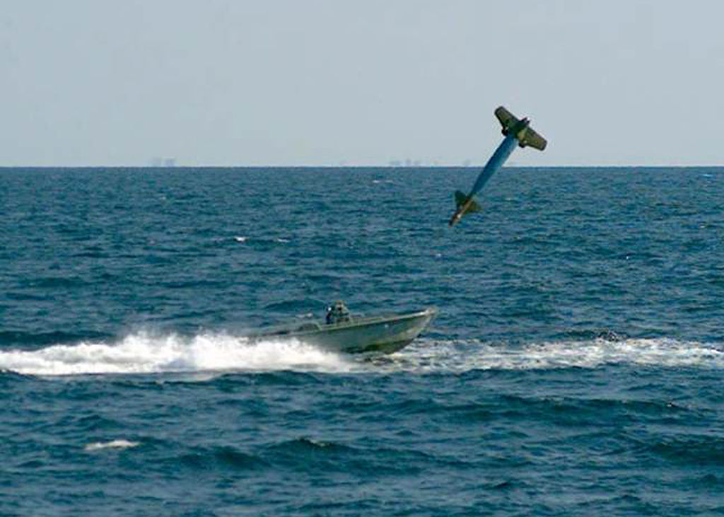 A laser guided bomb before it strikes a small boat during a training exercise